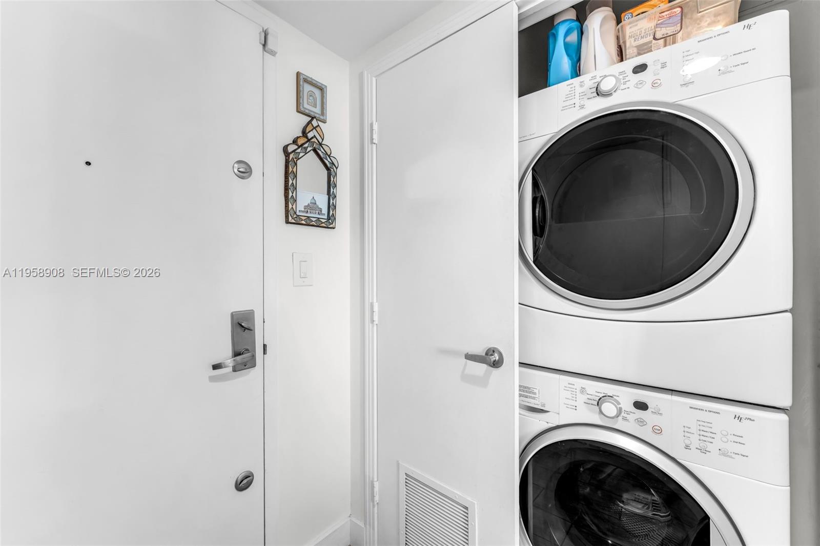 9066 Southwest 73rd Court, Unit 908 Miami, FL 33156 - Photo 22 of 46 a utility room with dryer and washer