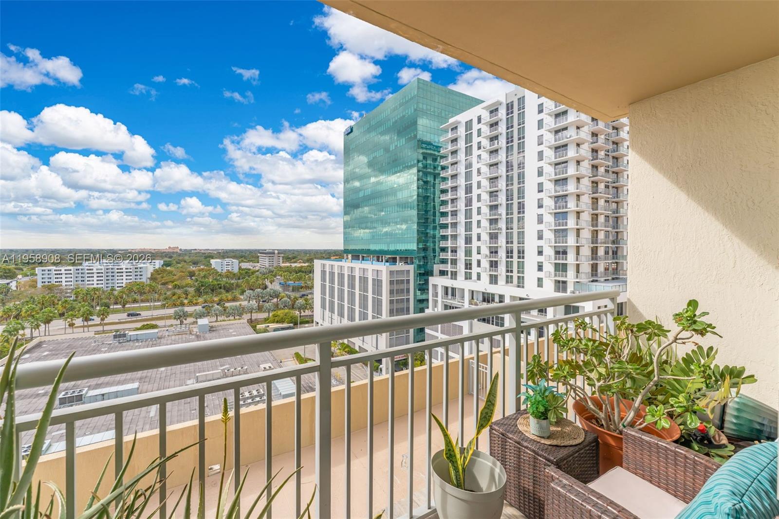 9066 Southwest 73rd Court, Unit 908 Miami, FL 33156 - Photo 25 of 46 a view of a chairs and table in the balcony