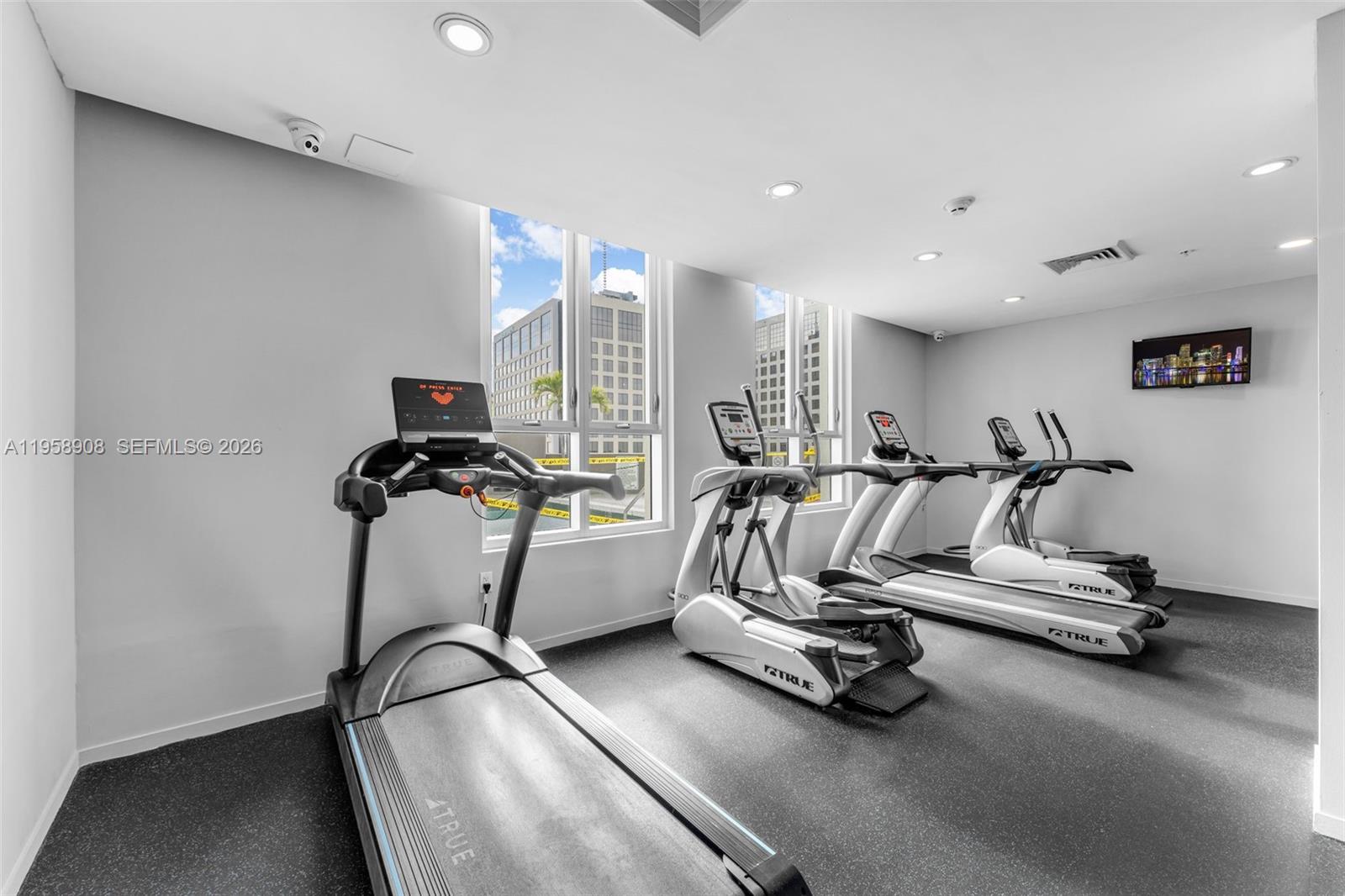 9066 Southwest 73rd Court, Unit 908 Miami, FL 33156 - Photo 29 of 46 a view of a room with gym equipment