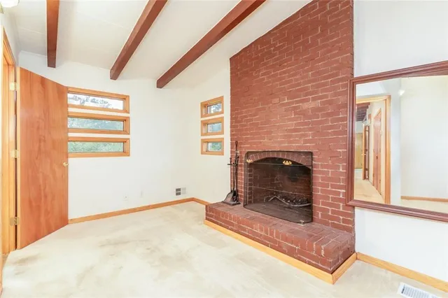 a bedroom with a bed and a fireplace