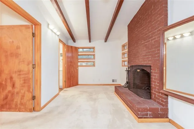 a view of a bathroom with a shower and toilet