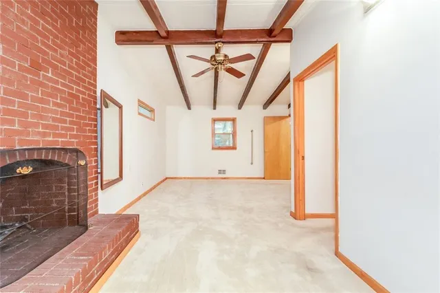 a spacious bathroom with a toilet sink and a mirror