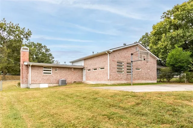 a view of a house with a yard and garage