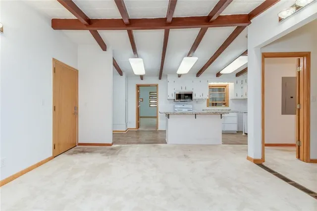 a view of a kitchen with a sink and cabinets