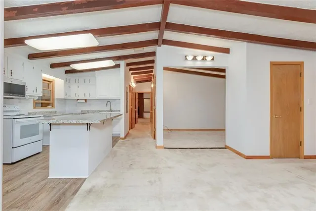 a view of a kitchen with a sink