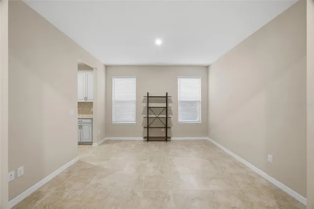 a view of an empty room with closet