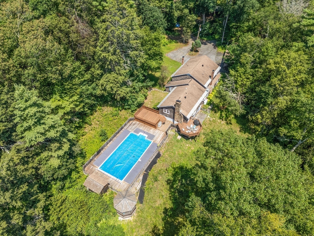 44 Mashapaug Road Holland, MA 01521 - Photo 29 of 41 an aerial view of a house with a yard and trees
