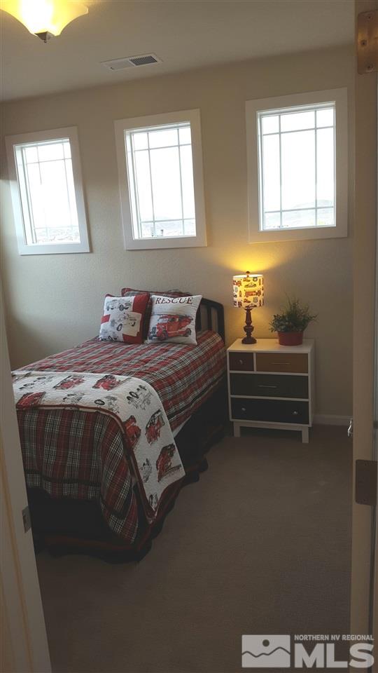 2010 Harmony Valley Way Reno, NV 89521 - Photo 6 of 7 a bedroom with bed and a window