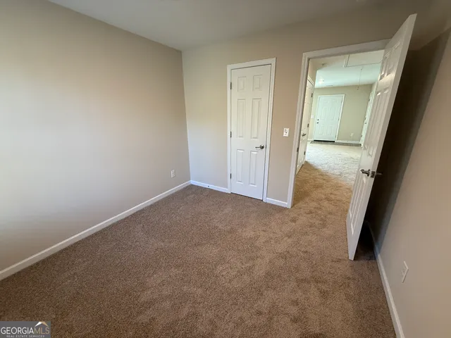 an empty room with mirror