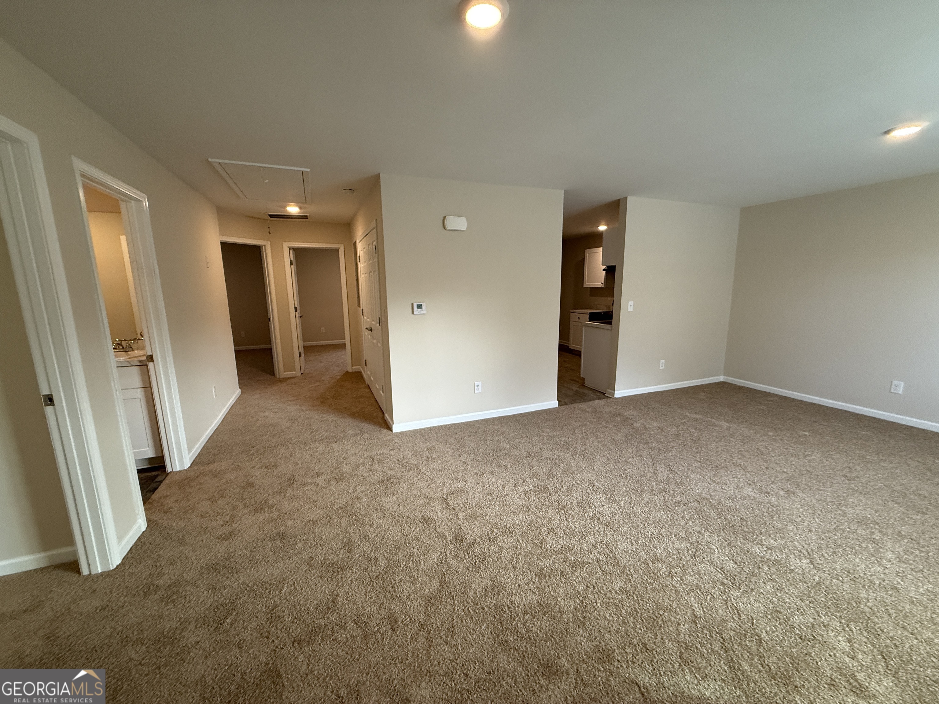 572 Elles Way Griffin, GA 30223 - Photo 3 of 23 an empty room with entrance and windows