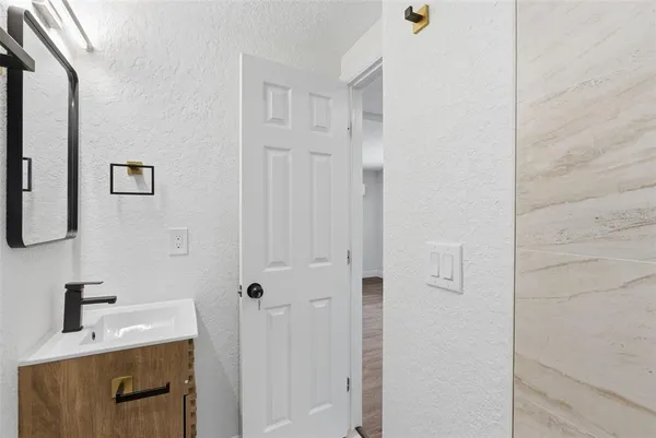 a bathroom with a sink toilet and vanity