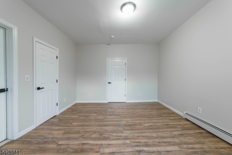 874 South 16th Street Newark, NJ 07108 - Photo 15 of 22 a view of empty room with wooden floor