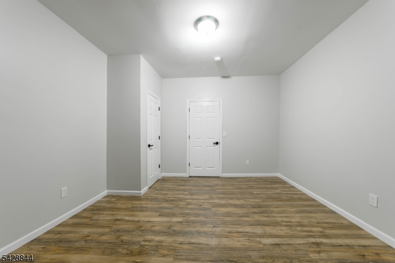 874 South 16th Street Newark, NJ 07108 - Photo 20 of 22 wooden floor in an empty room