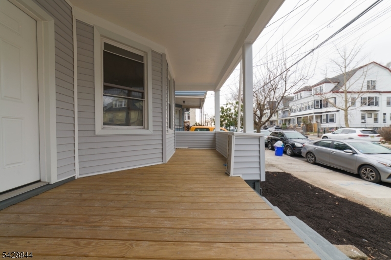 874 South 16th Street Newark, NJ 07108 - Photo 3 of 22 a front view of a house with a yard
