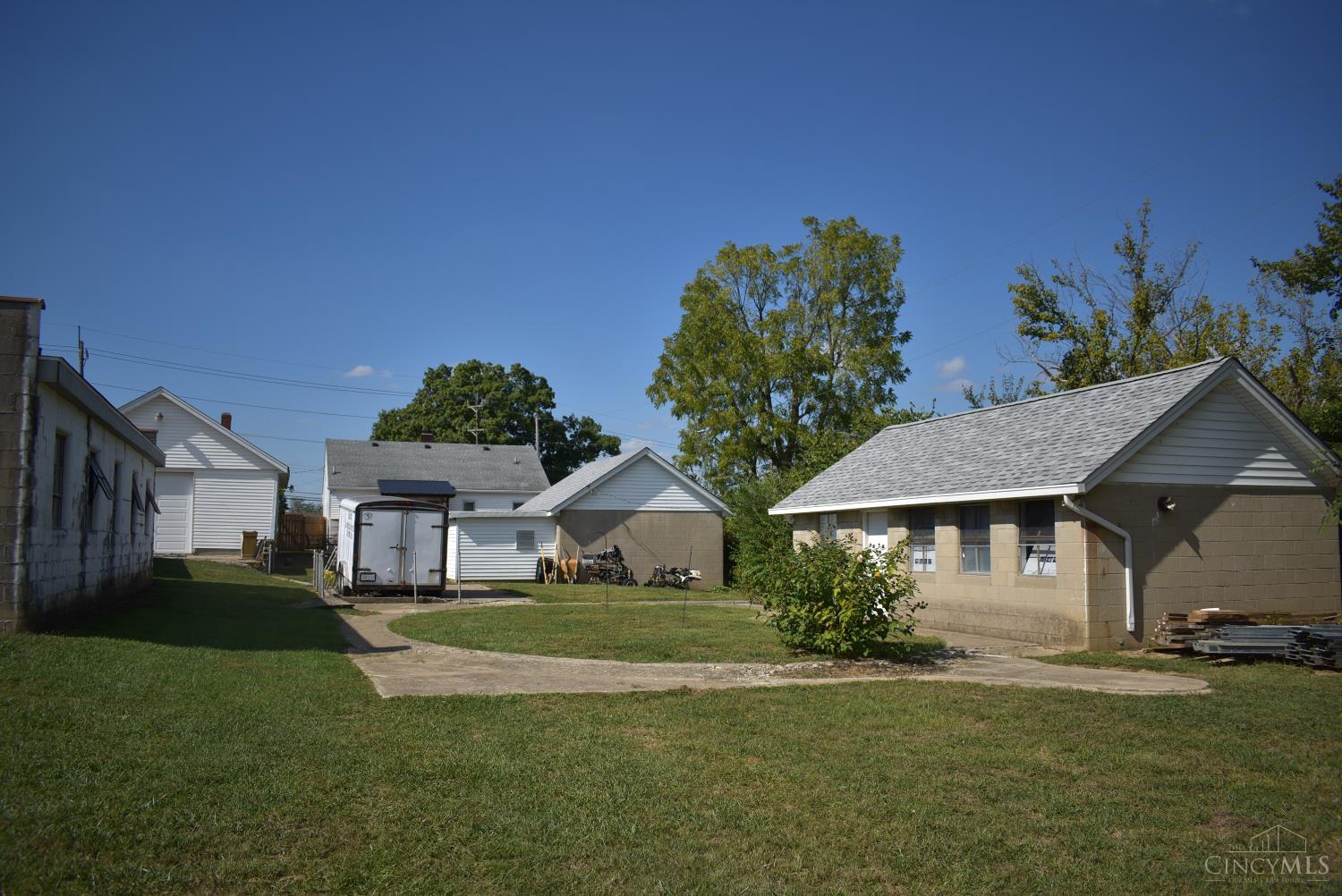 1804 Tuley Road Hamilton, OH 45015 - Photo 6 of 41 Looking from midway in backyard to building that was once the pool house you can see where the inground pool was located in the circle and filled in