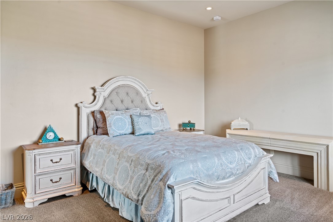 1123 Christian Road Henderson, NV 89002 - Photo 46 of 94 Plush carpet and soft lighting create a peaceful atmosphere in this private bedroom retreat.