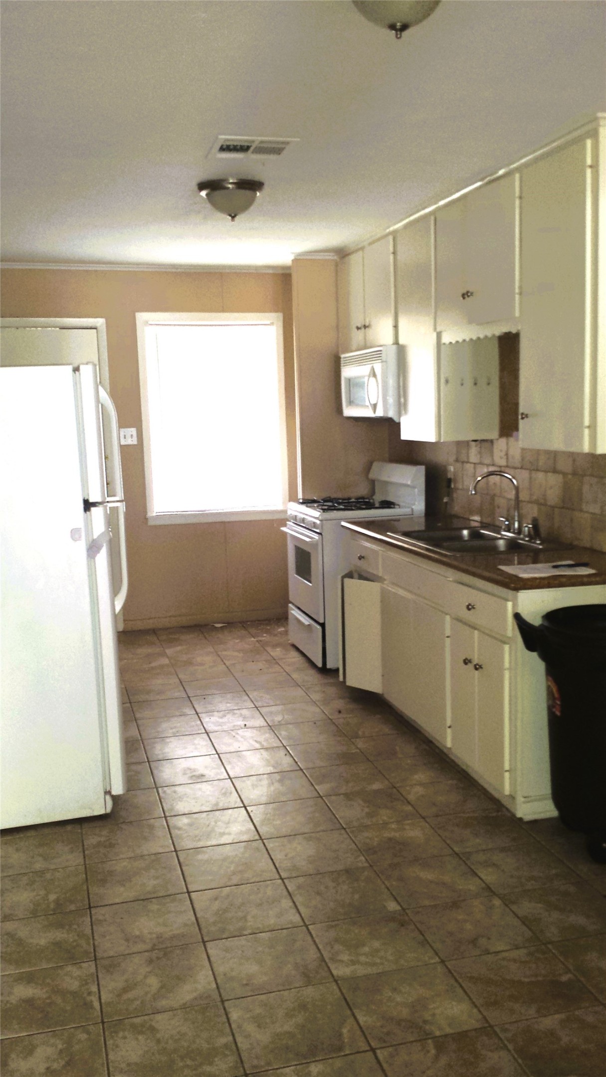 3810 Cochran Street Houston, TX 77009 - Photo 5 of 12 a kitchen with stainless steel appliances granite countertop a sink and a stove