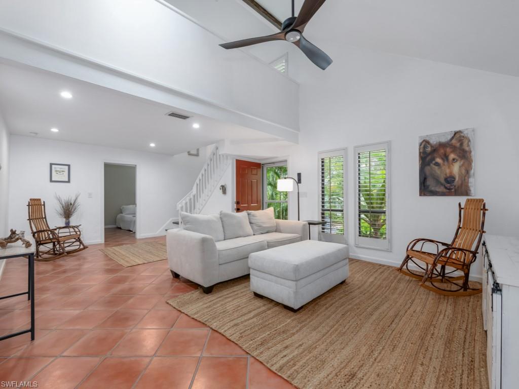 1271 Solana Road, Unit E4 Naples, FL 34103 - Photo 1 of 21 a living room with furniture and a large window