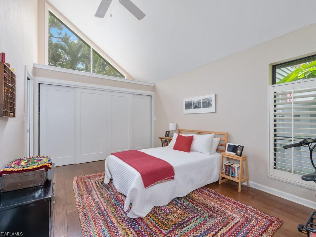 1271 Solana Road, Unit E4 Naples, FL 34103 - Photo 11 of 21 a bedroom with a bed and a window