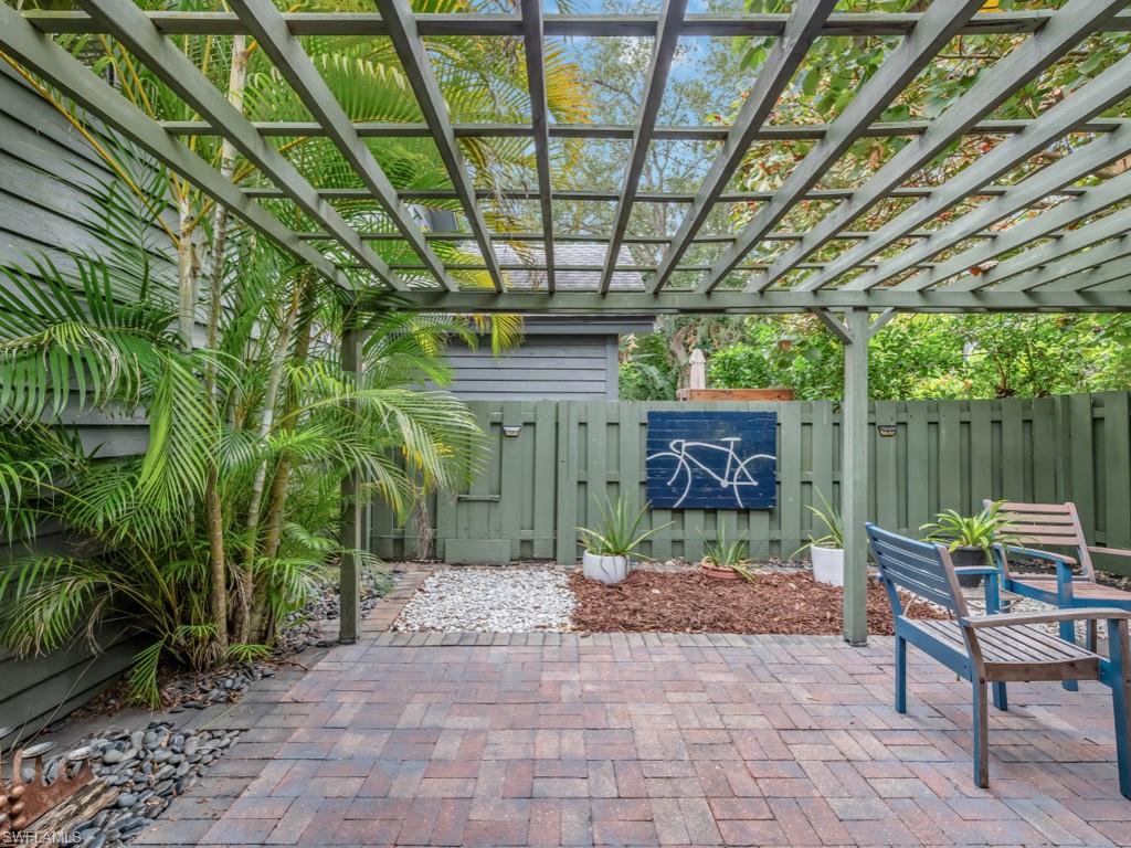 1271 Solana Road, Unit E4 Naples, FL 34103 - Photo 7 of 21 a garden view with a seating space