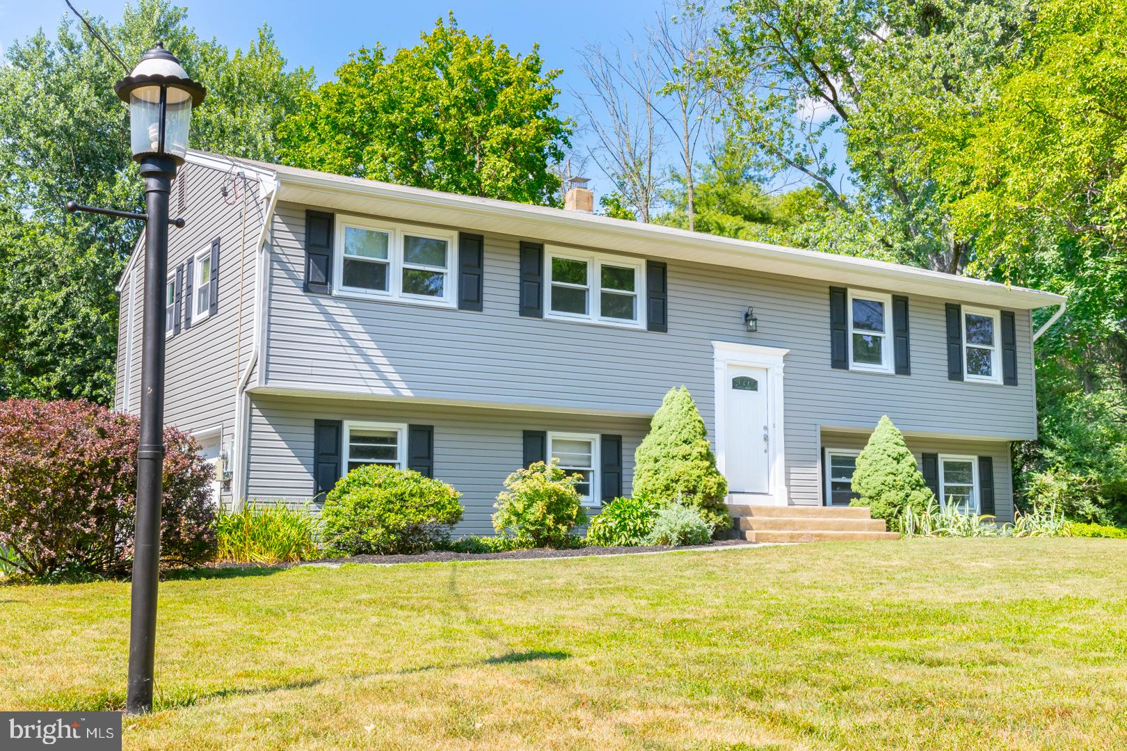 16 Quaker Road Princeton Junction, NJ 08550 - Photo 8 of 68 a front view of a house with a yard