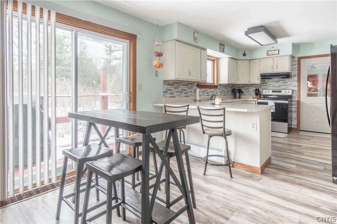 22925 Duffy Road Le Ray, NY 13601 - Photo 8 of 34 Dining Room/Kitchen. Access to Deck