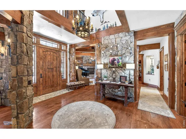 a bedroom with furniture and a chandelier