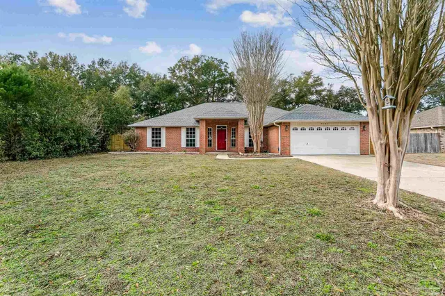 a house view with a garden space