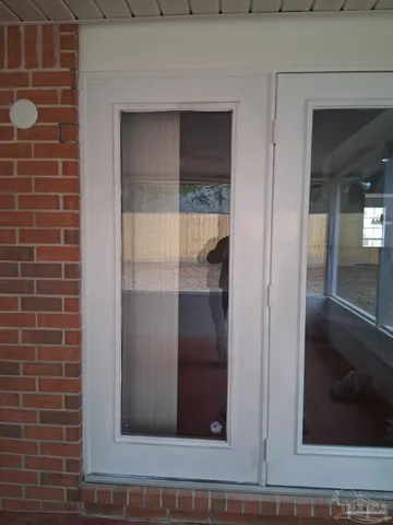 a view of an empty room with a sliding door