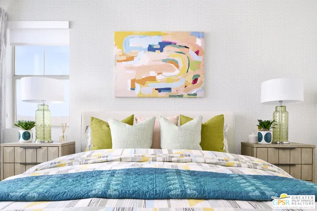 a spacious bedroom with a bed and a window