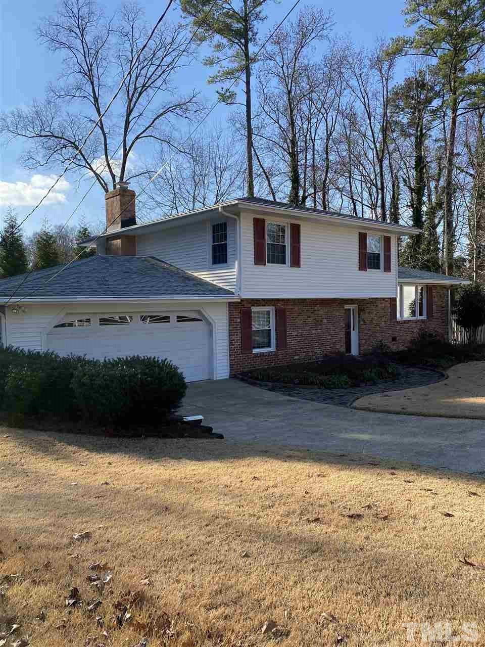 1001 Rutgers Court Raleigh, NC 27609 - Photo 2 of 14 a front view of a house with a yard