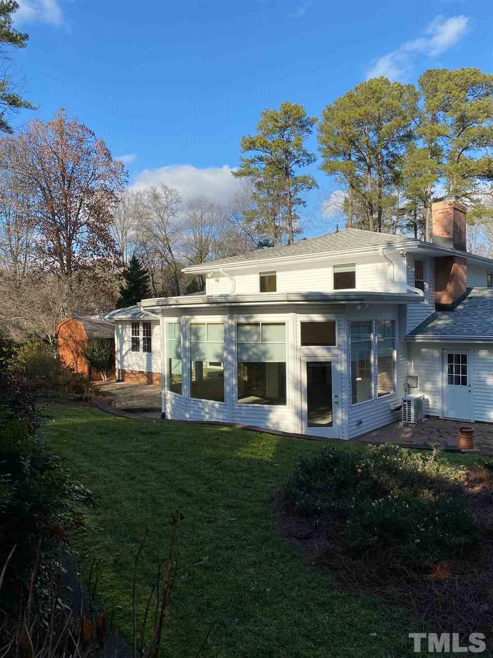 1001 Rutgers Court Raleigh, NC 27609 - Photo 11 of 14 a front view of a building with a garden