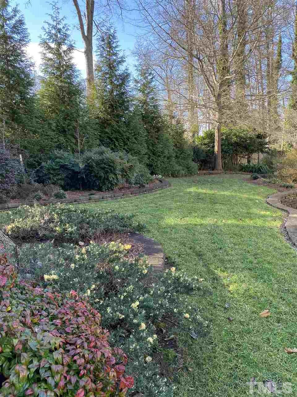 1001 Rutgers Court Raleigh, NC 27609 - Photo 12 of 14 a view of a yard with plants and large trees