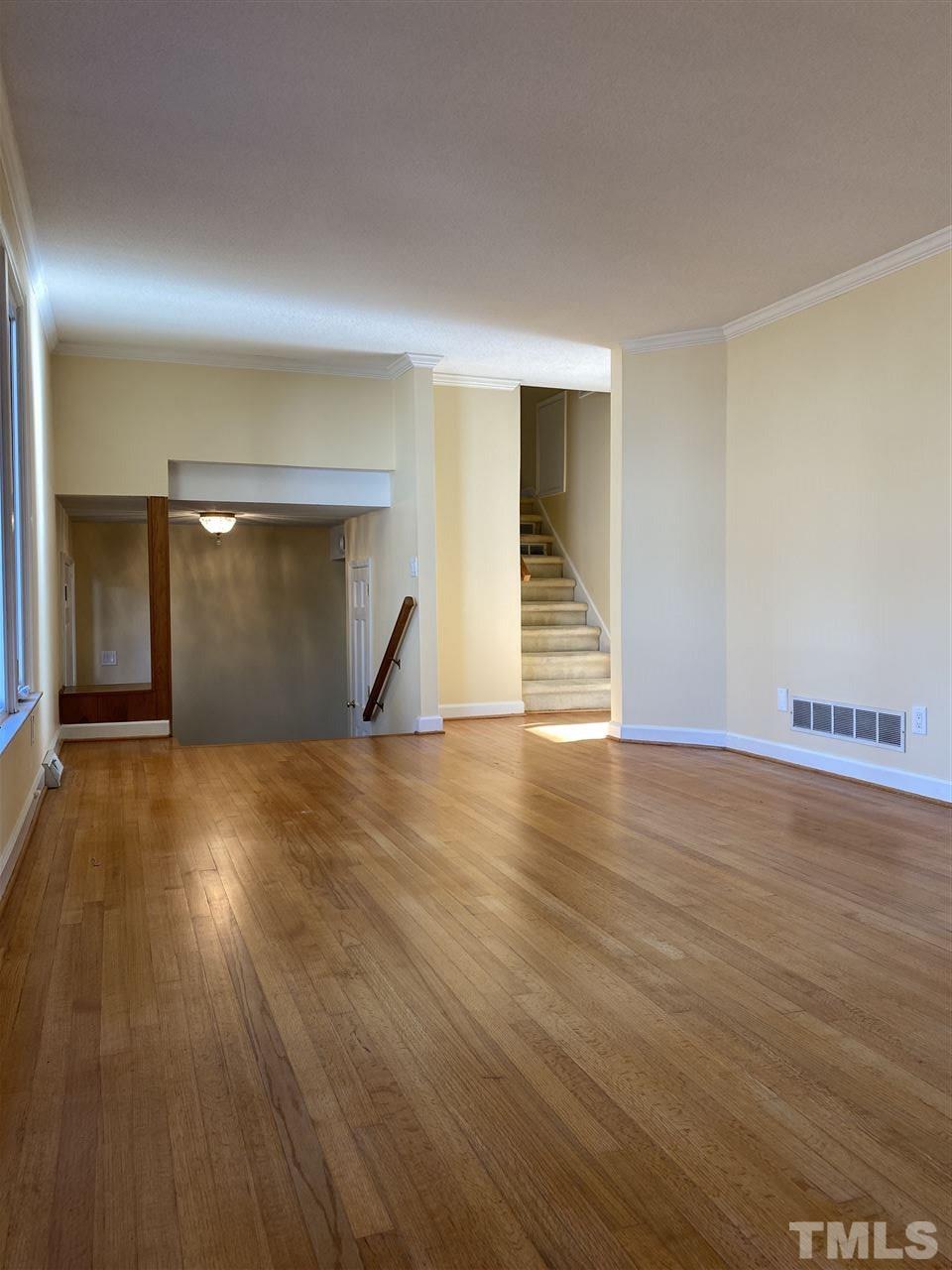 1001 Rutgers Court Raleigh, NC 27609 - Photo 5 of 14 a view of empty room with wooden floor and entertaining space