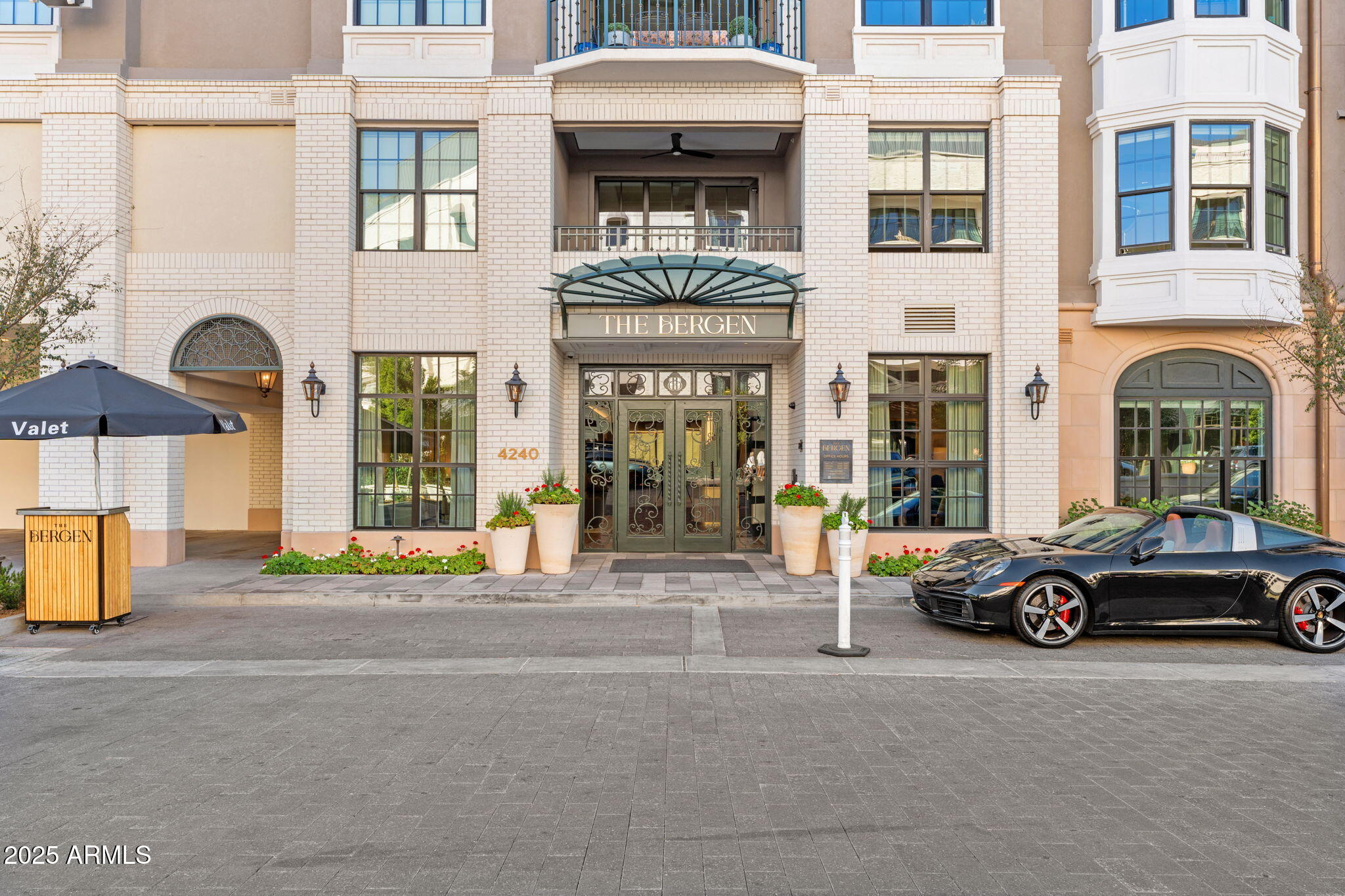4240 East Camelback Road, Unit 401 Phoenix, AZ 85018 - Photo 2 of 10 a car parked in front of a building