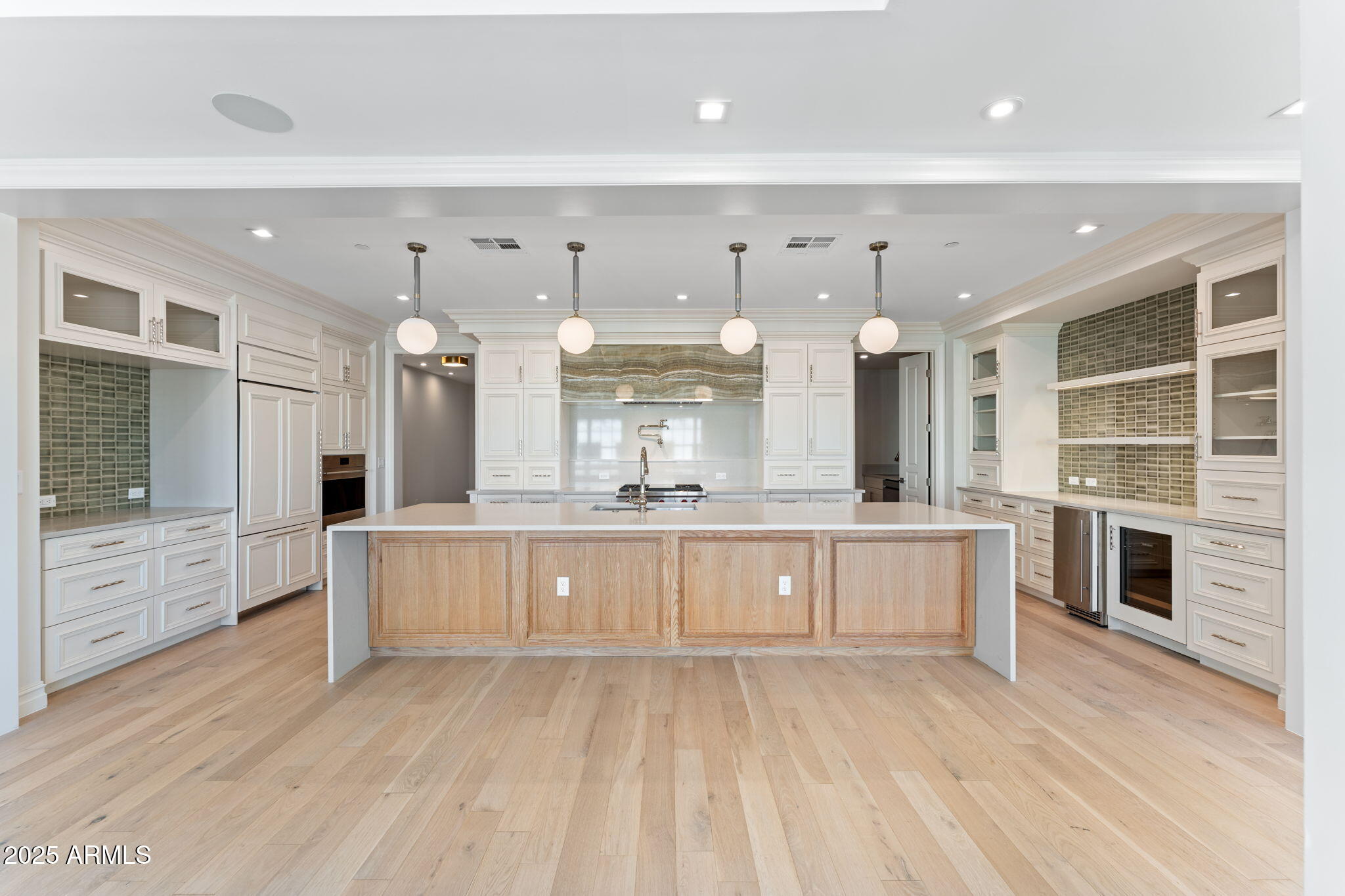 4240 East Camelback Road, Unit 401 Phoenix, AZ 85018 - Photo 5 of 10 a large kitchen with stainless steel appliances kitchen island granite countertop a large cabinets a sink and a stove
