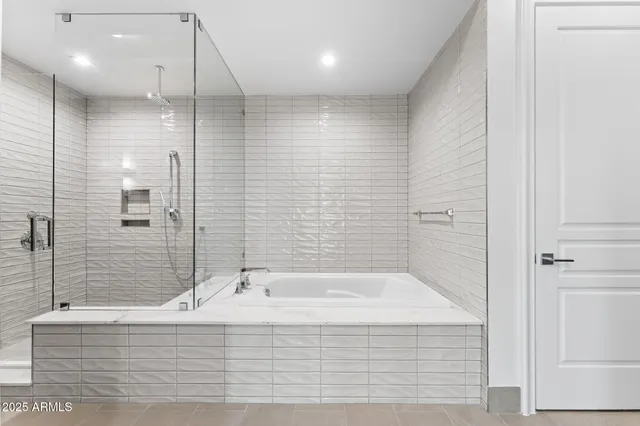 a large kitchen with stainless steel appliances kitchen island granite countertop a large cabinets a sink and a stove