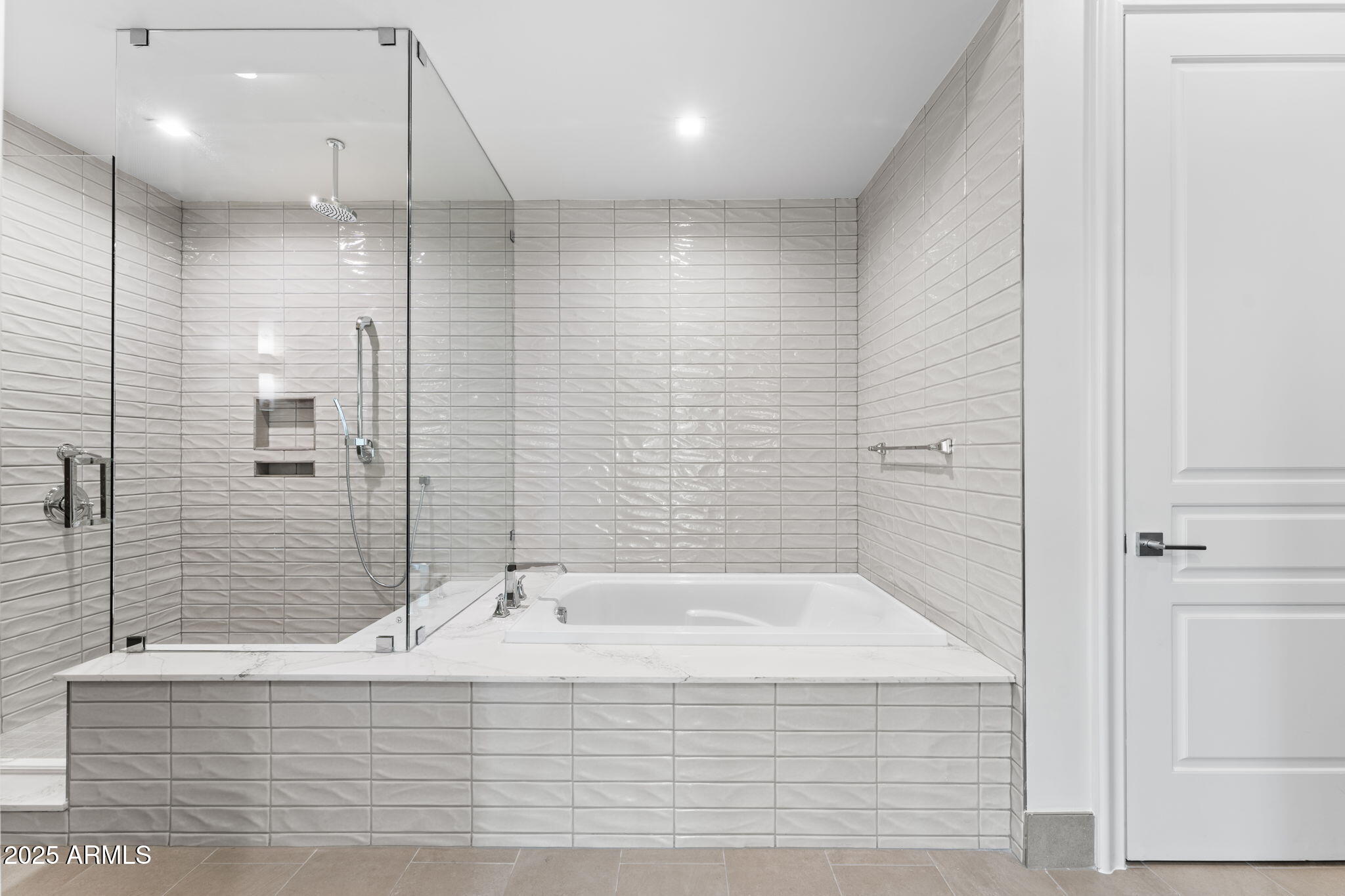4240 East Camelback Road, Unit 401 Phoenix, AZ 85018 - Photo 6 of 10 a bathroom with a bathtub and a sink