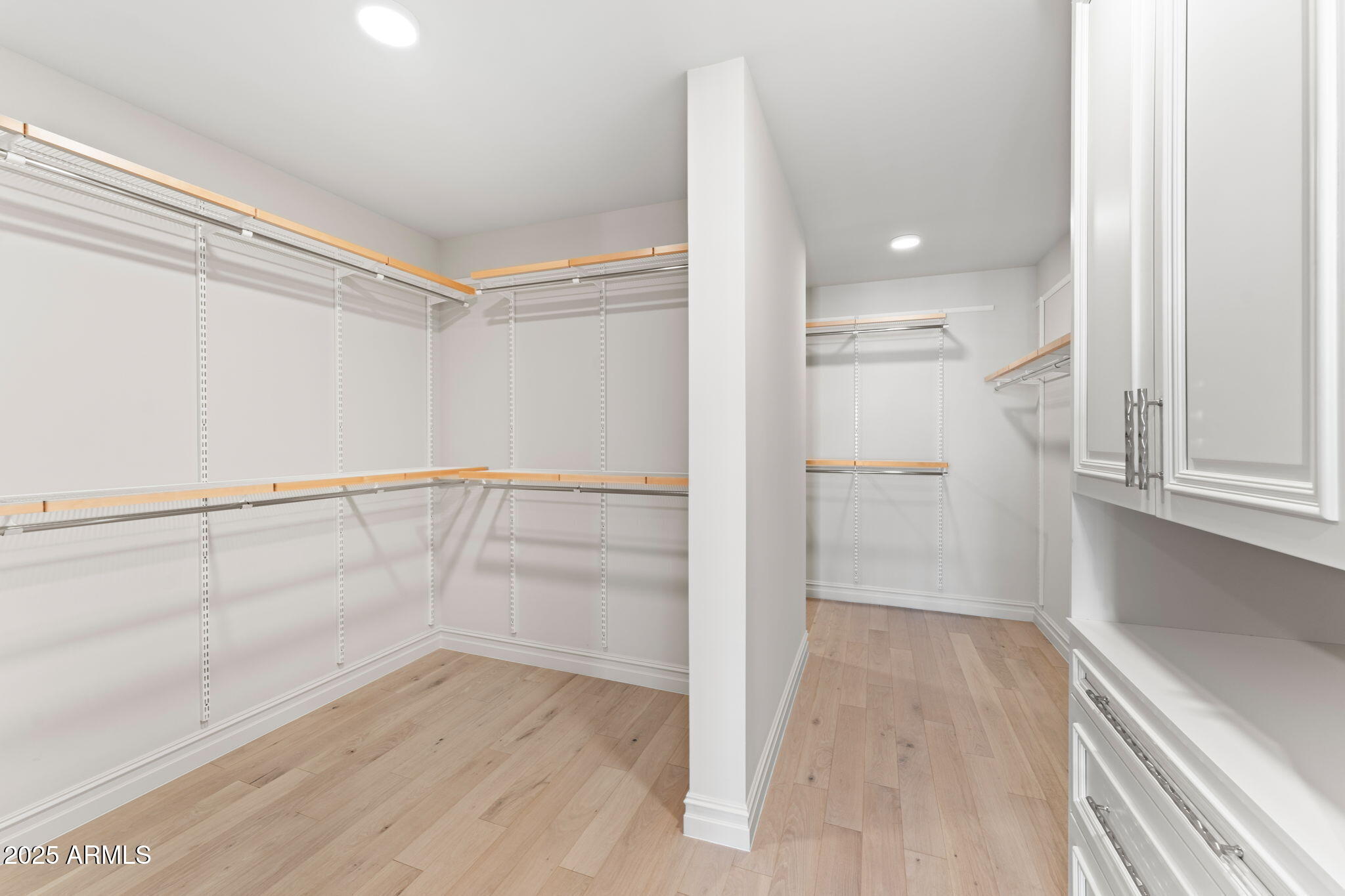 4240 East Camelback Road, Unit 401 Phoenix, AZ 85018 - Photo 7 of 10 a view of an empty walk in closet