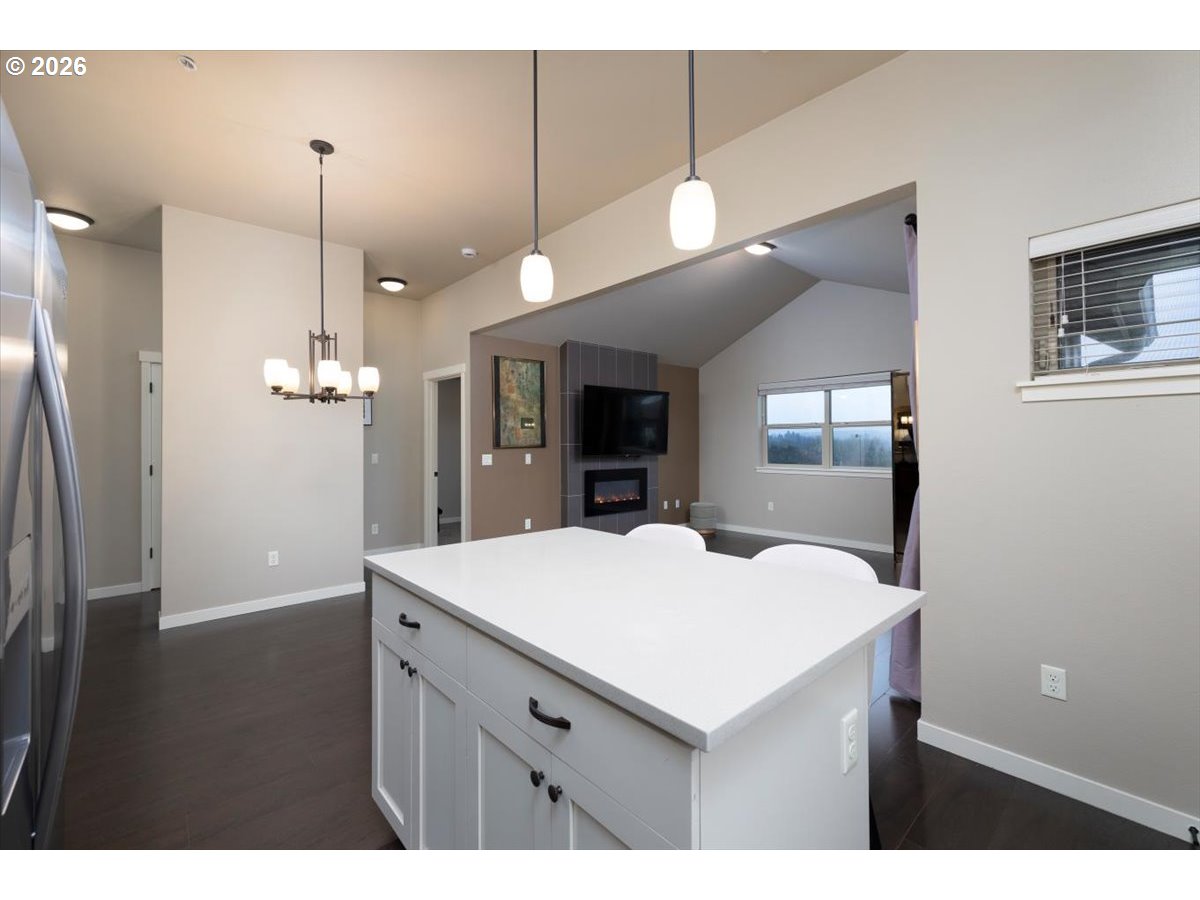 13895 Southwest Meridian Street, Unit 412 Beaverton, OR 97005 - Photo 12 of 38 a kitchen with a sink a counter space and wooden floor