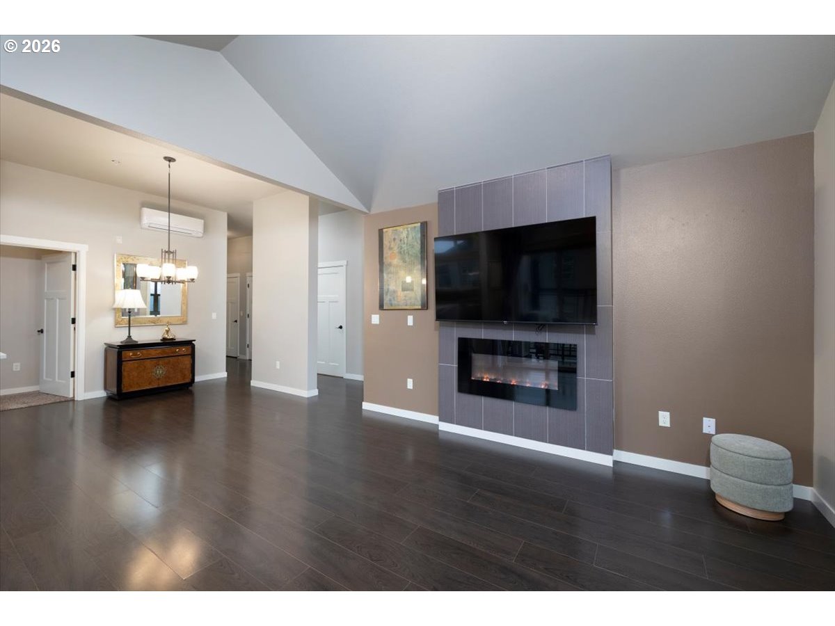 13895 Southwest Meridian Street, Unit 412 Beaverton, OR 97005 - Photo 14 of 38 a living room with furniture and a flat screen tv