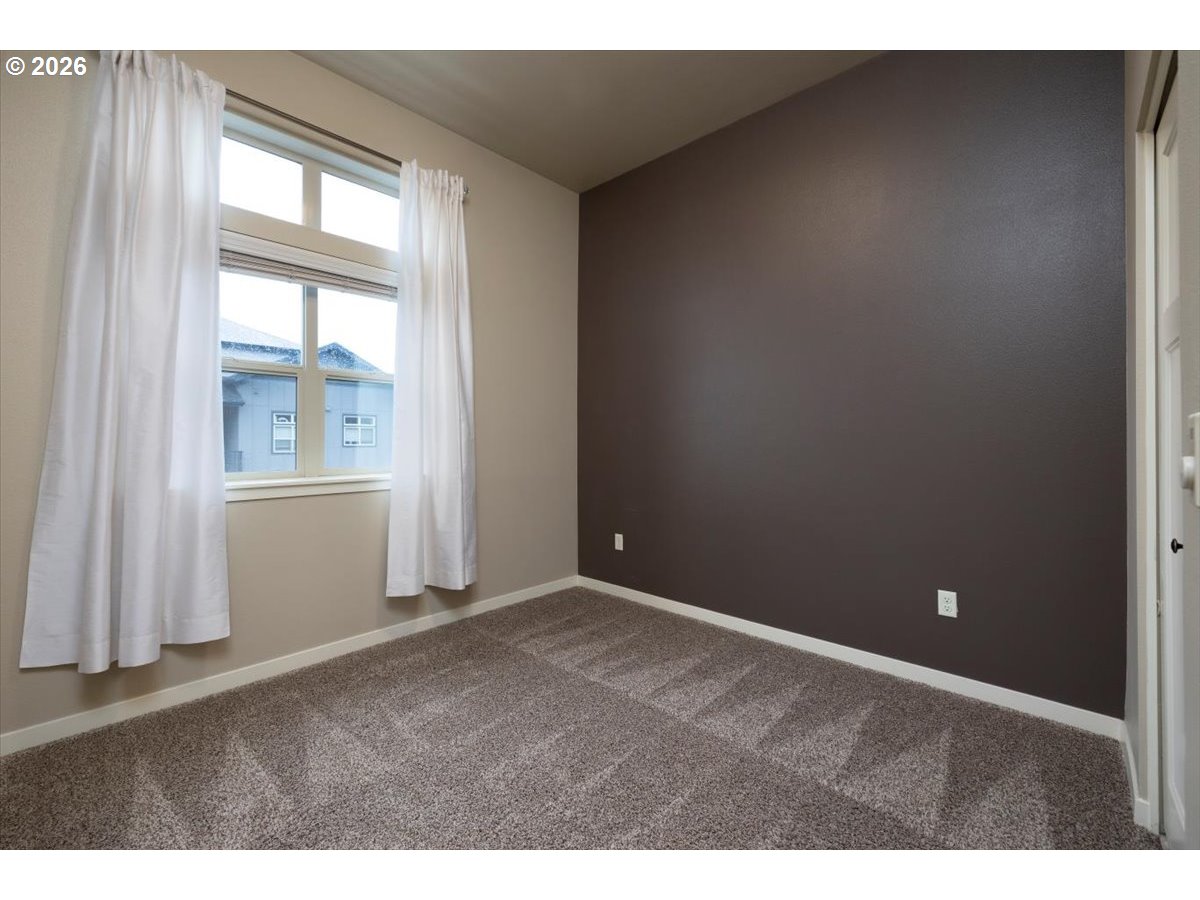 13895 Southwest Meridian Street, Unit 412 Beaverton, OR 97005 - Photo 17 of 38 a view of an empty room and a window