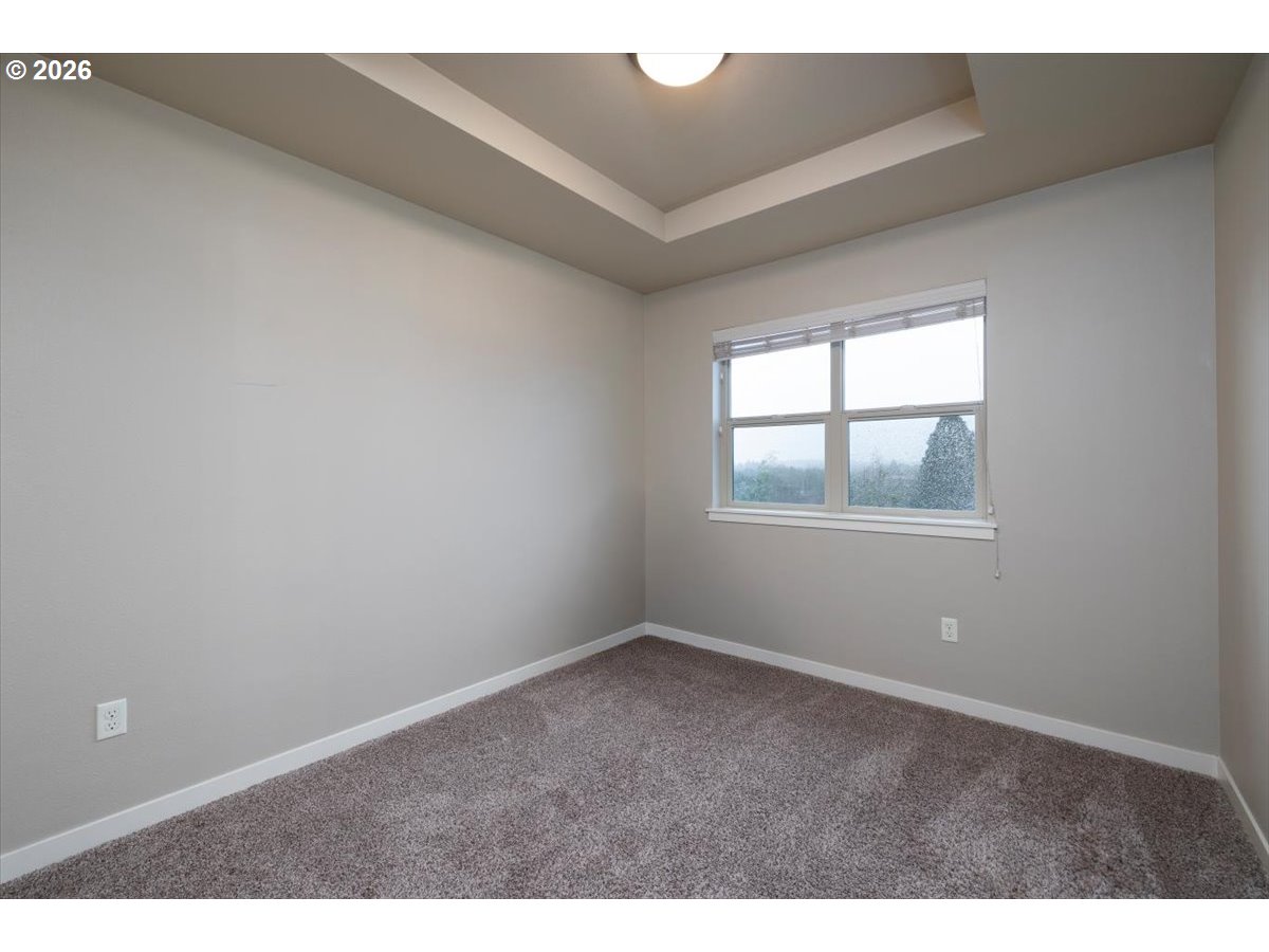 13895 Southwest Meridian Street, Unit 412 Beaverton, OR 97005 - Photo 20 of 38 a view of an empty room with windows