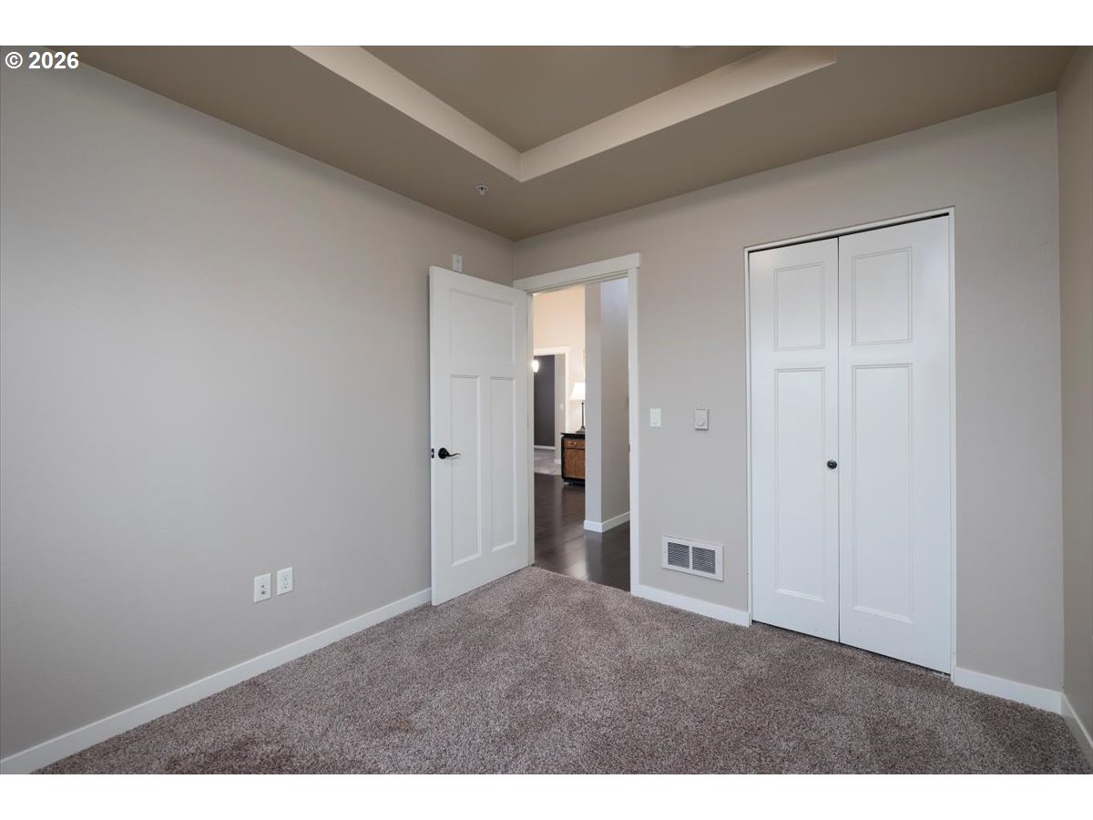 13895 Southwest Meridian Street, Unit 412 Beaverton, OR 97005 - Photo 21 of 38 a view of an empty room and closet