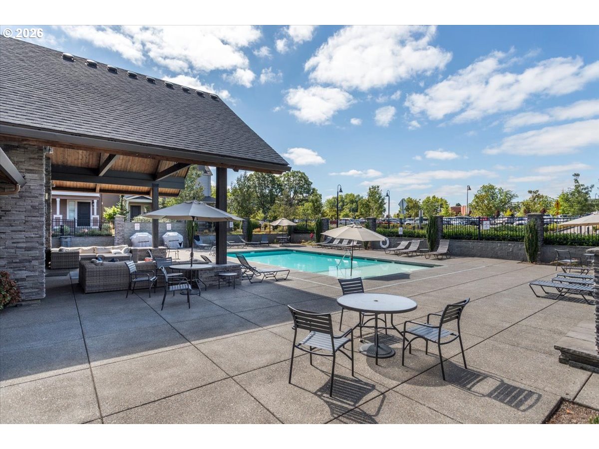 13895 Southwest Meridian Street, Unit 412 Beaverton, OR 97005 - Photo 24 of 38 a patio with a table and chairs