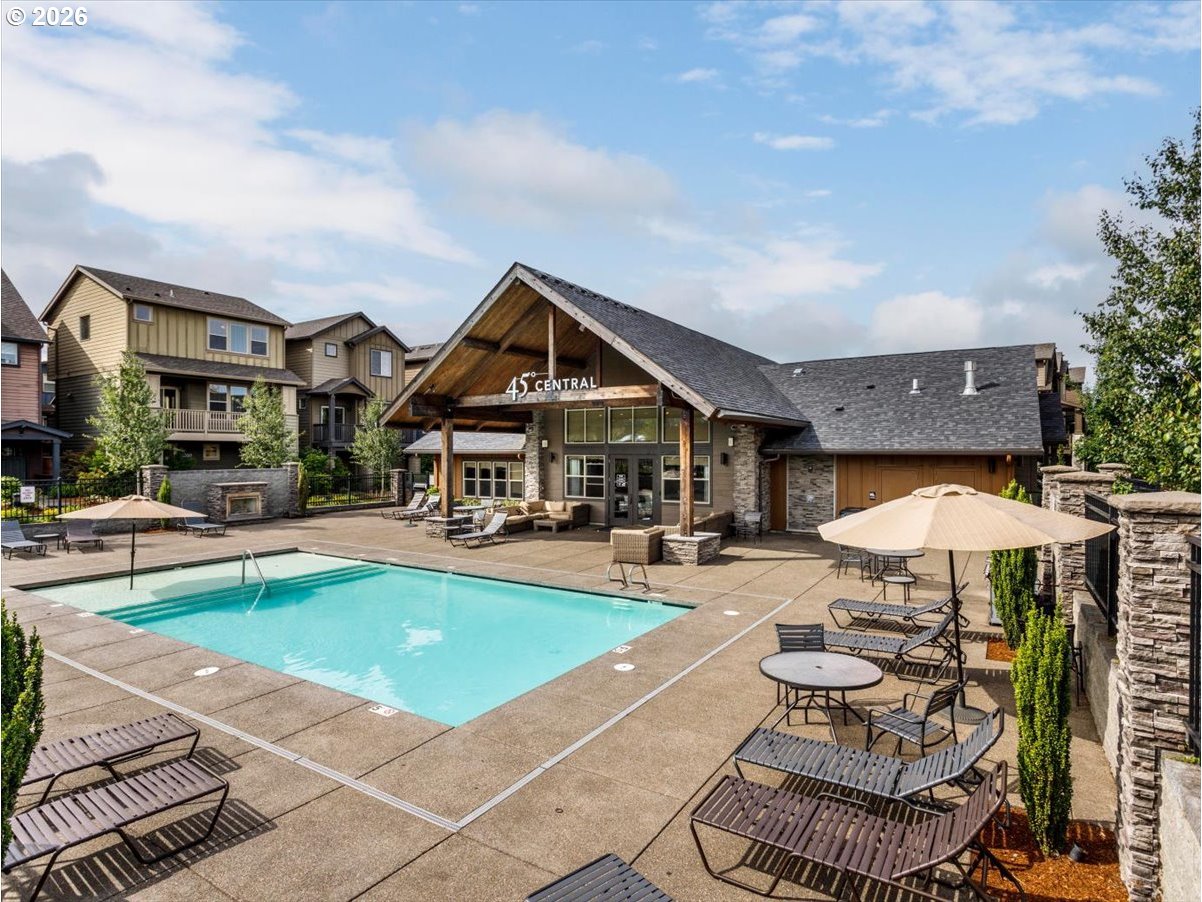 13895 Southwest Meridian Street, Unit 412 Beaverton, OR 97005 - Photo 25 of 38 a view of a house with swimming pool and sitting area