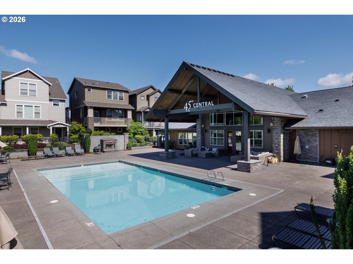 13895 Southwest Meridian Street, Unit 412 Beaverton, OR 97005 - Photo 27 of 38 a view of a house with sitting area and swimming pool