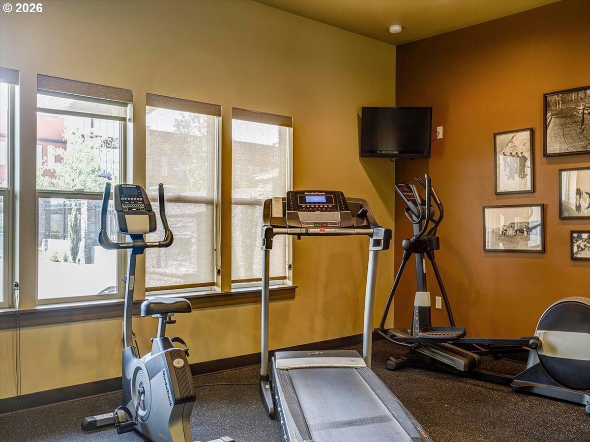 13895 Southwest Meridian Street, Unit 412 Beaverton, OR 97005 - Photo 28 of 38 a room with gym equipment and windows