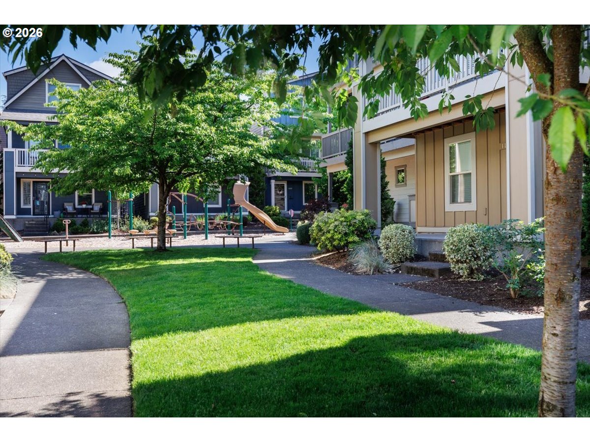 13895 Southwest Meridian Street, Unit 412 Beaverton, OR 97005 - Photo 34 of 38 a view of a house with a yard