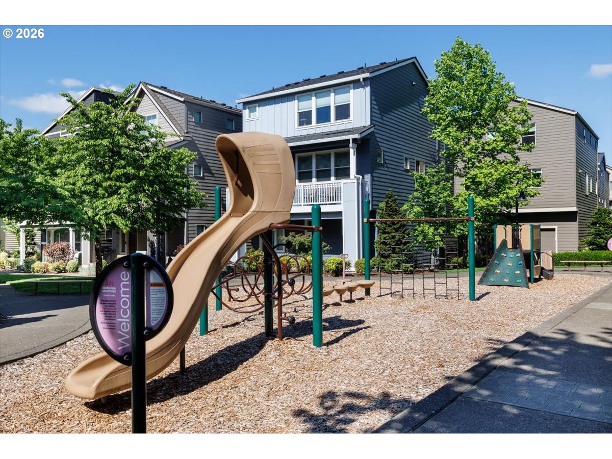 13895 Southwest Meridian Street, Unit 412 Beaverton, OR 97005 - Photo 36 of 38 a backyard of a house with table and chairs